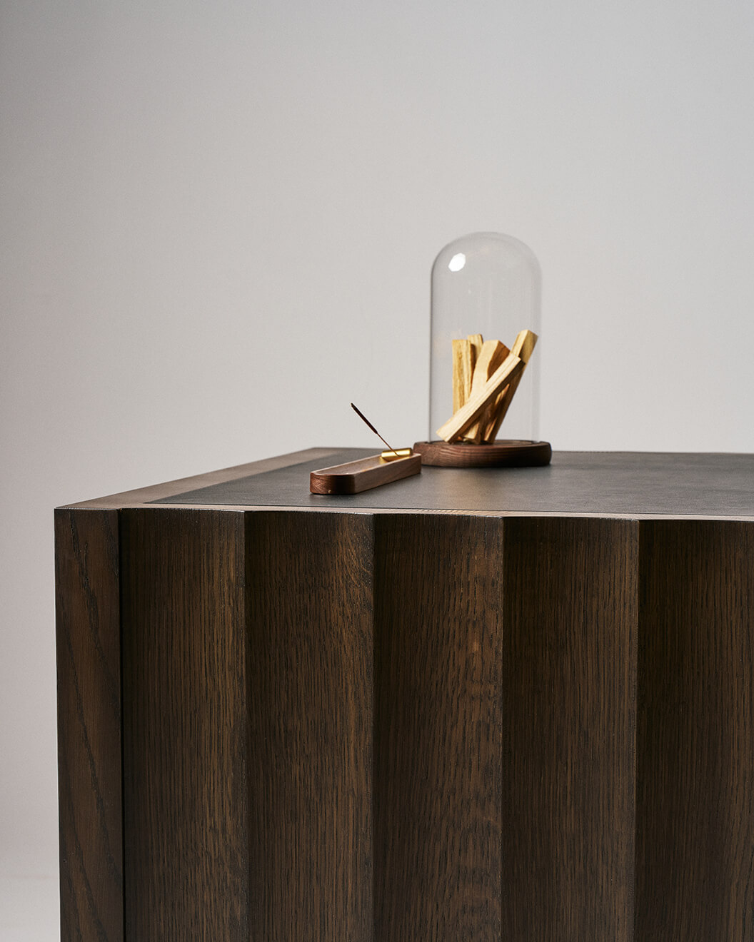 Sculptural wooden nightstand with vertical grooves